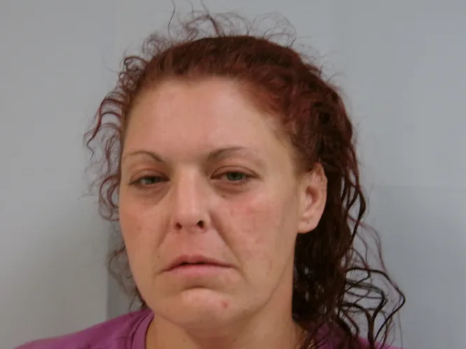 Woman accused of striking man with oxygen tank